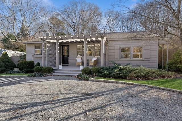 view of front of house featuring a pergola and covered porch