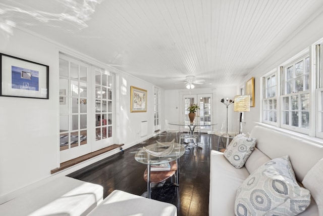 living room featuring hardwood / wood-style flooring, wood ceiling, and french doors