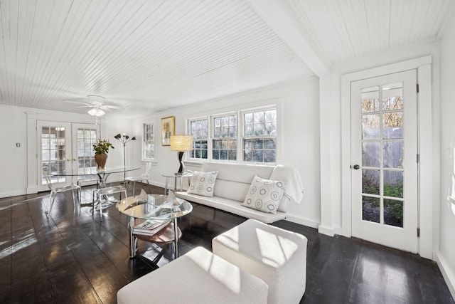 living room with ceiling fan, dark wood-type flooring, wood ceiling, and french doors