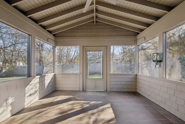 unfurnished sunroom featuring lofted ceiling with beams and wood ceiling