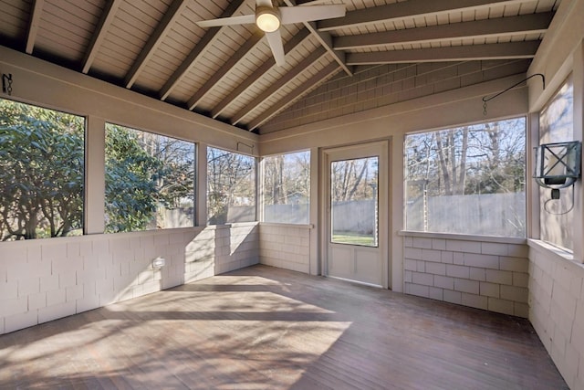 unfurnished sunroom featuring vaulted ceiling with beams, wooden ceiling, and ceiling fan