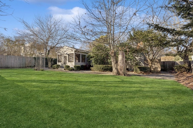 view of yard featuring a sunroom