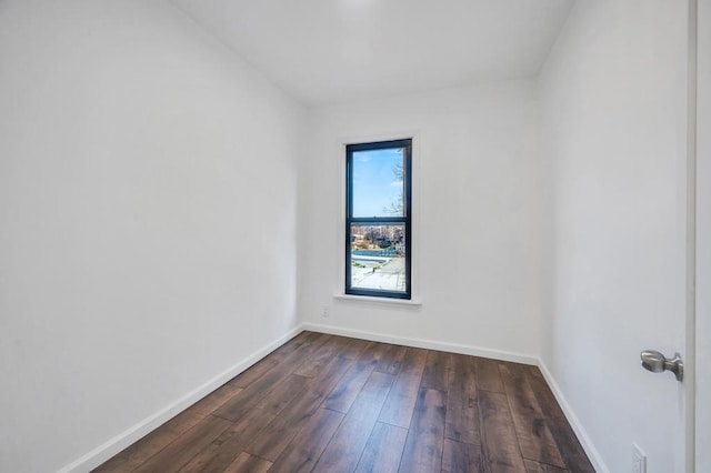 spare room featuring dark hardwood / wood-style floors