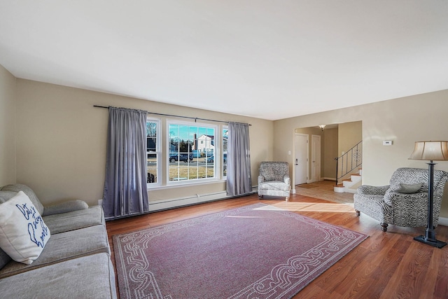 living room with hardwood / wood-style floors and a baseboard radiator