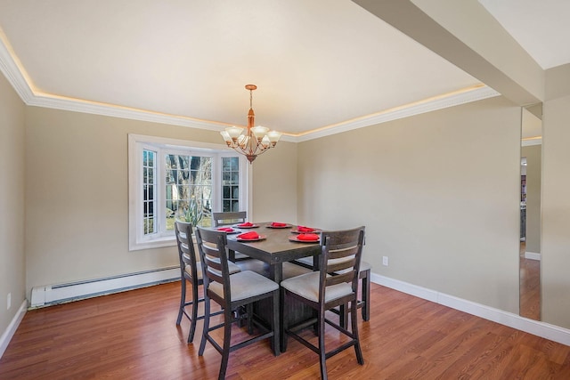 dining space with hardwood / wood-style floors, a baseboard radiator, ornamental molding, and a chandelier