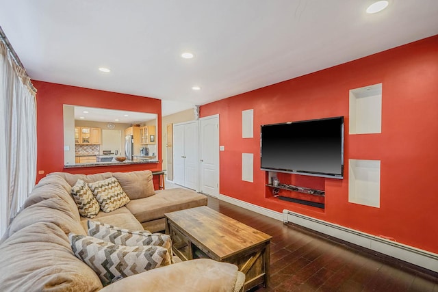 living room featuring a baseboard radiator and hardwood / wood-style floors