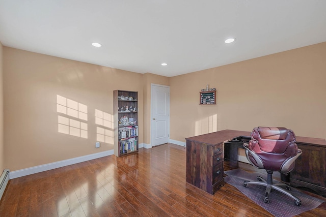 office space with hardwood / wood-style floors and a baseboard radiator