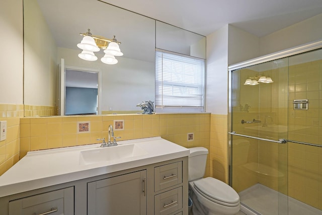 bathroom with tile walls, an enclosed shower, and toilet