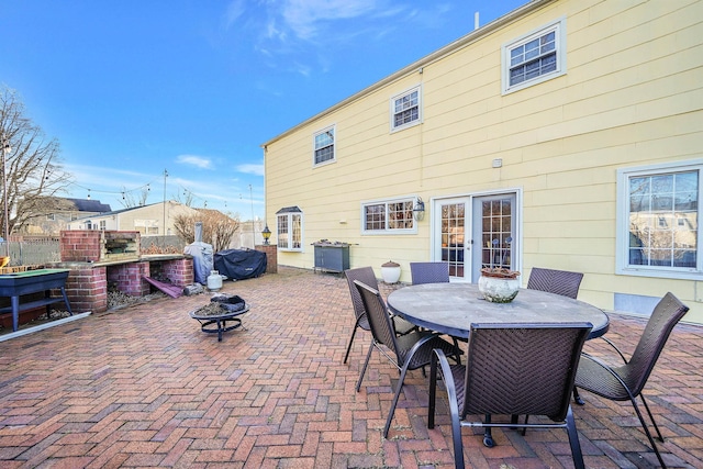 view of patio / terrace with an outdoor fire pit