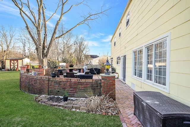 view of yard featuring a shed and a patio