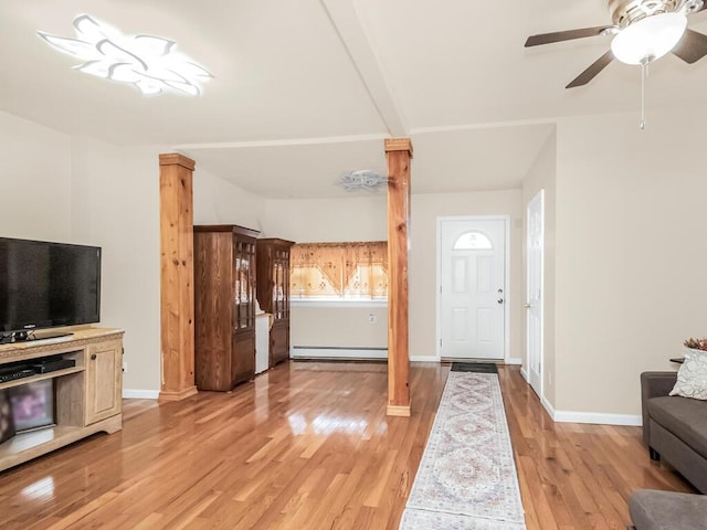 foyer entrance featuring baseboard heating, ceiling fan, and light hardwood / wood-style flooring