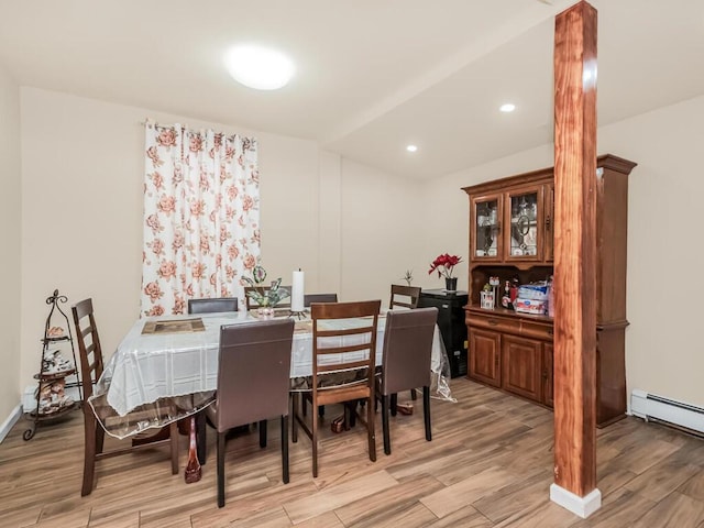 dining room featuring light hardwood / wood-style floors and baseboard heating