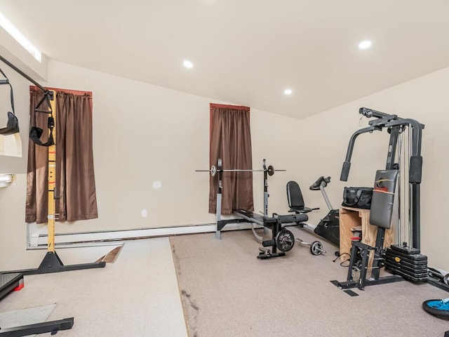 exercise room featuring a baseboard heating unit