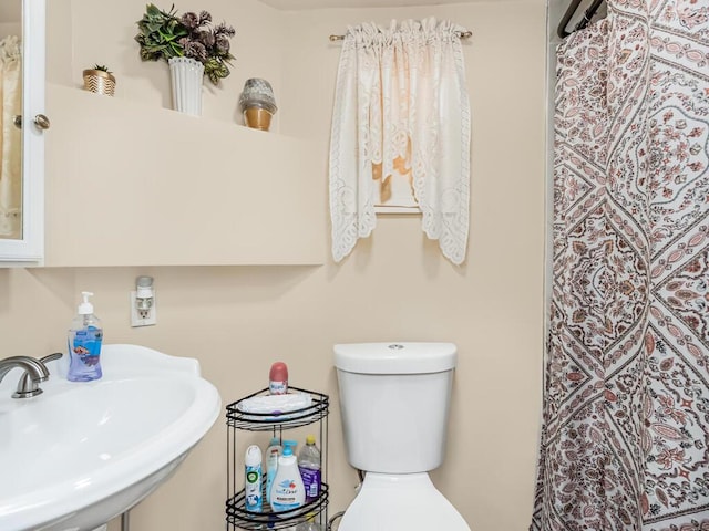 bathroom with sink and toilet