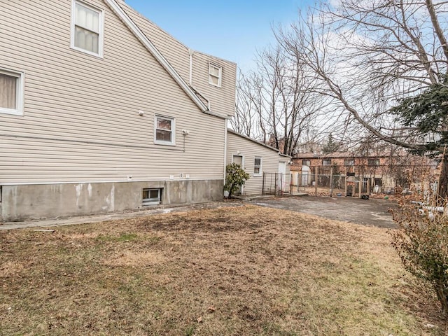 view of side of property with a yard