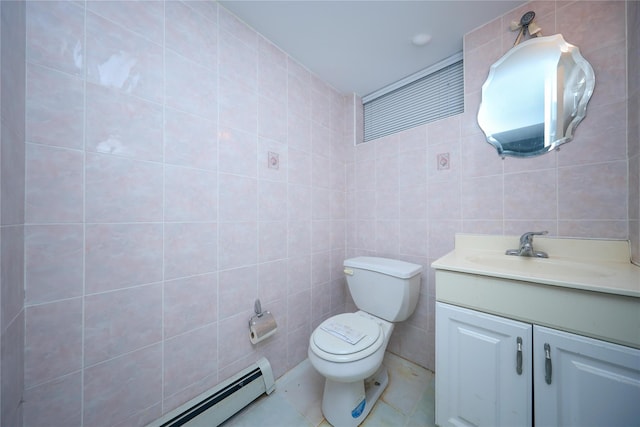 bathroom featuring baseboard heating, tile walls, vanity, tile patterned floors, and toilet