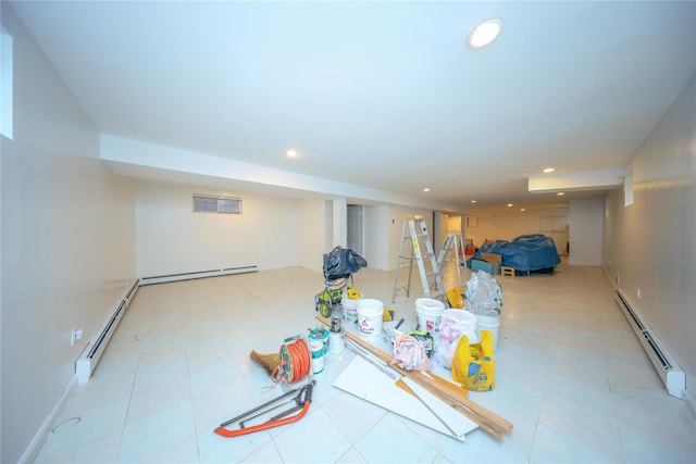 basement featuring a baseboard radiator and light tile patterned floors