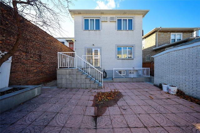 back of house featuring a patio