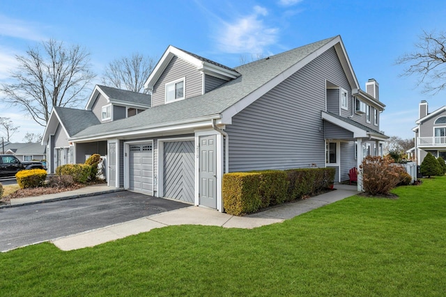 view of property exterior featuring a garage and a lawn