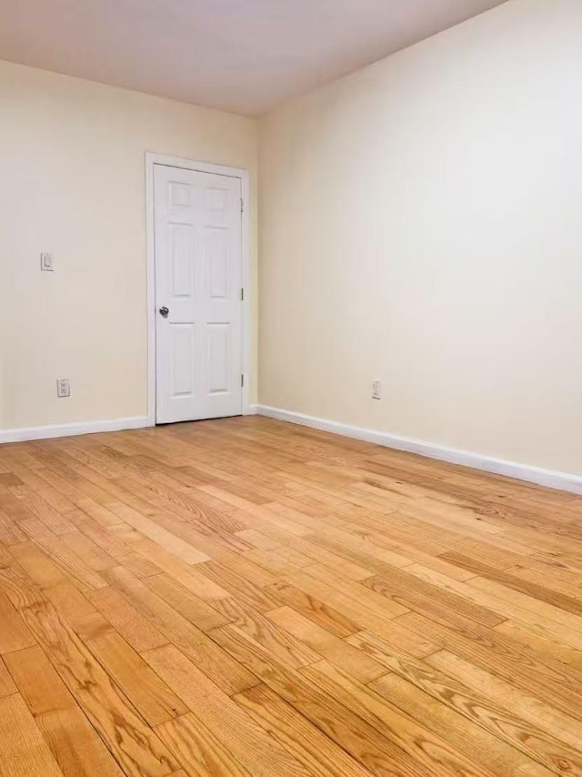 spare room featuring light wood-type flooring