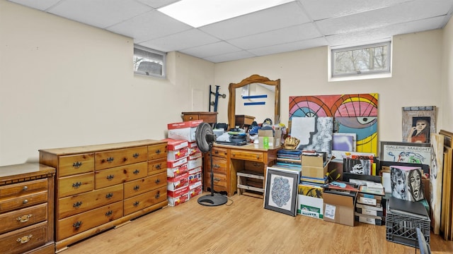 office featuring a drop ceiling and light hardwood / wood-style flooring