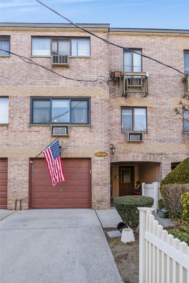 townhome / multi-family property featuring a garage