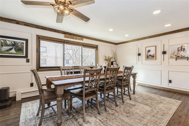 dining area featuring dark hardwood / wood-style flooring, a baseboard radiator, ornamental molding, and ceiling fan