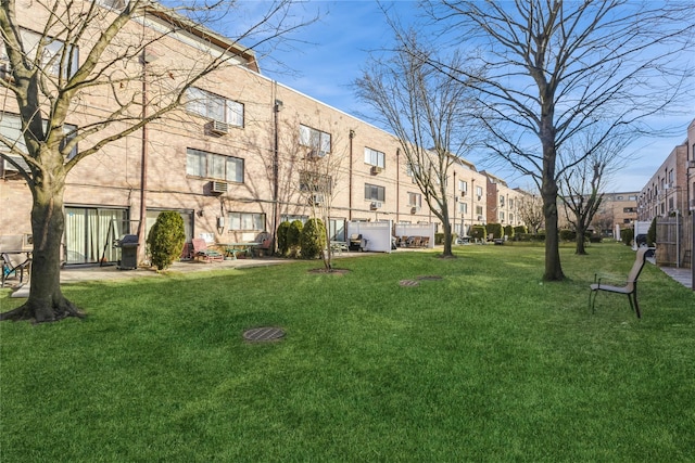 view of community featuring a lawn