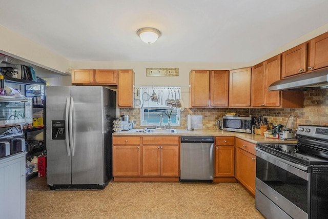 kitchen featuring tasteful backsplash, sink, and stainless steel appliances