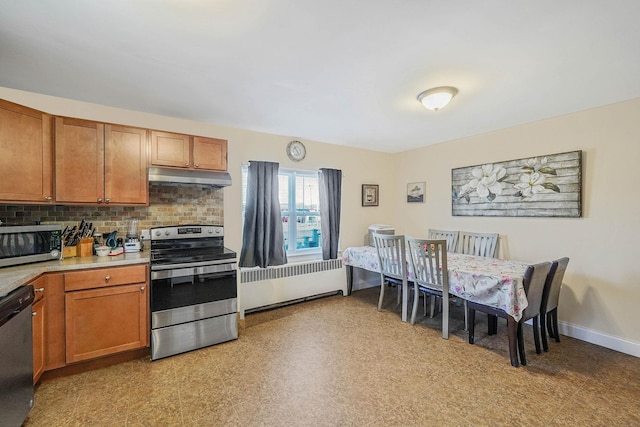 kitchen with decorative backsplash, radiator heating unit, and stainless steel appliances