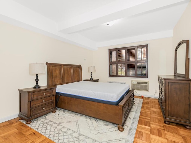 bedroom with light parquet flooring, radiator, and a wall mounted air conditioner