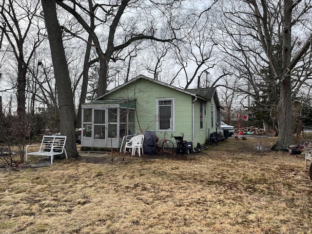 back of house with a sunroom