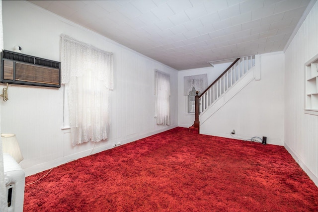 interior space featuring a wall mounted air conditioner and ornamental molding