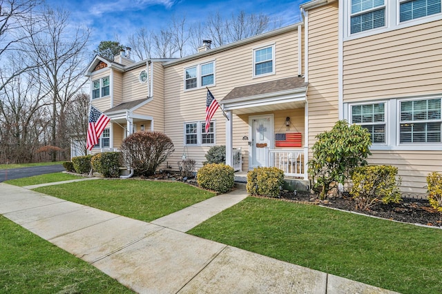 view of property featuring a front yard