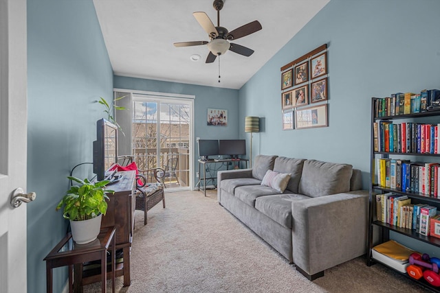 living room with vaulted ceiling, ceiling fan, and carpet floors