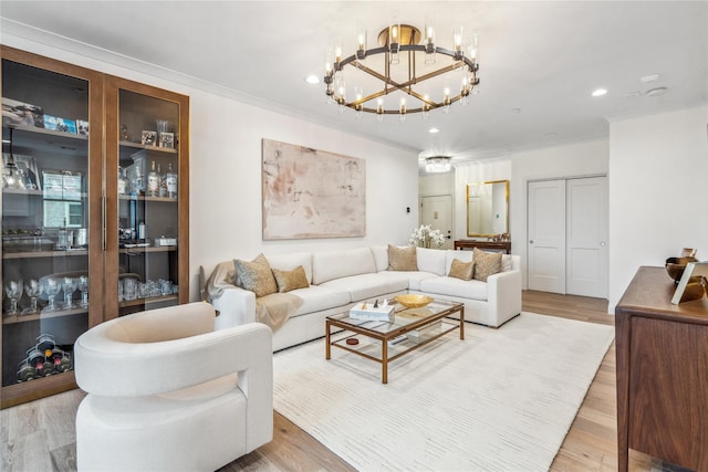 living room featuring hardwood / wood-style flooring and crown molding