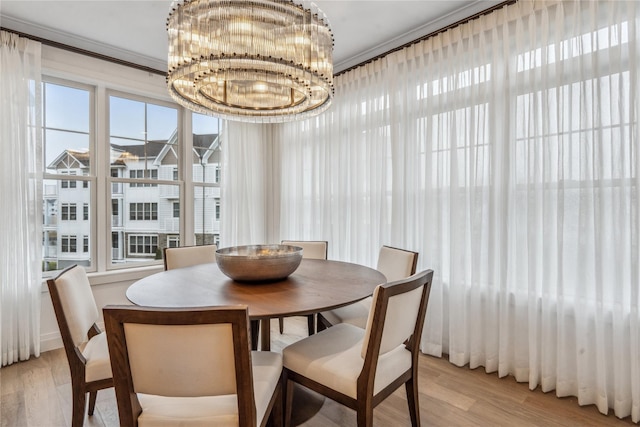 dining room with a notable chandelier and light hardwood / wood-style floors