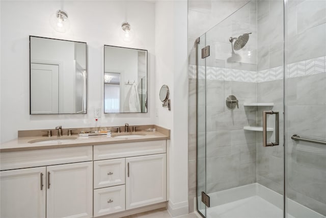 bathroom with a shower with door and vanity