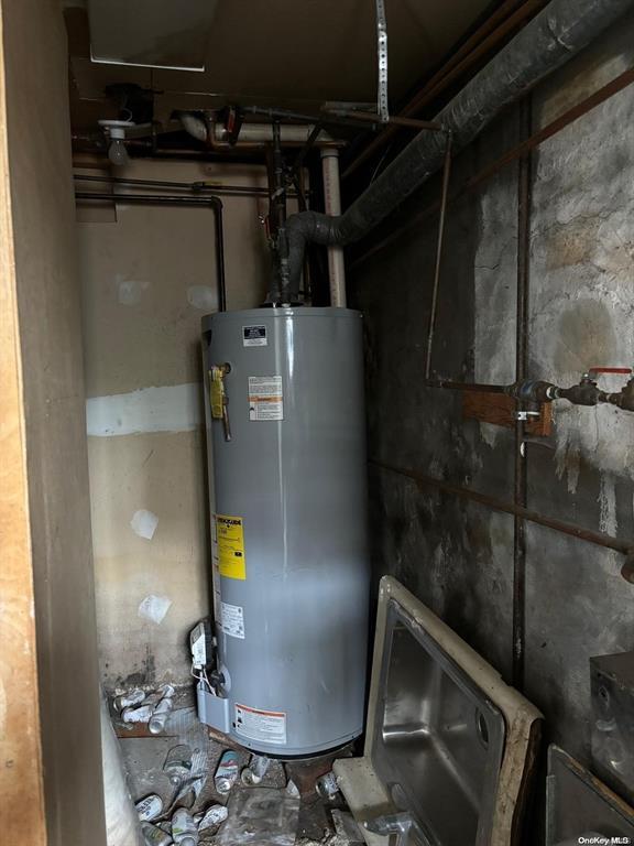 utility room featuring gas water heater