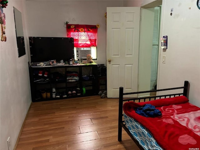 bedroom with hardwood / wood-style floors