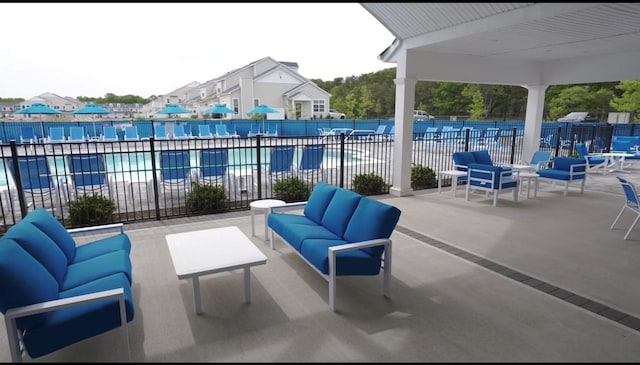 view of patio / terrace with an outdoor hangout area and a community pool