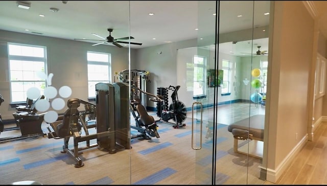 exercise room with ceiling fan