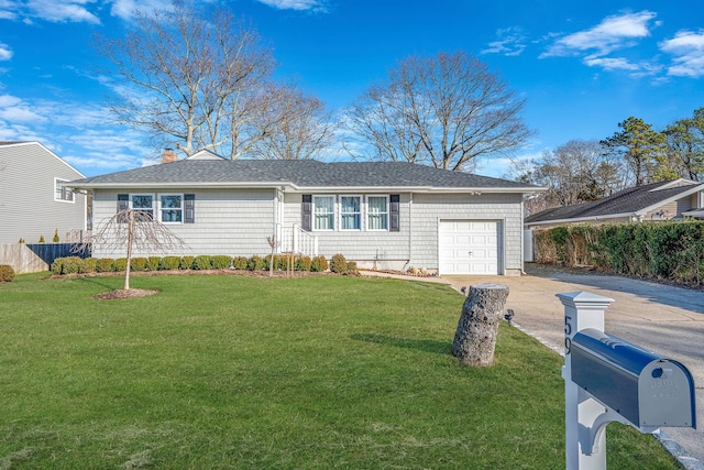 ranch-style home featuring a garage and a front lawn