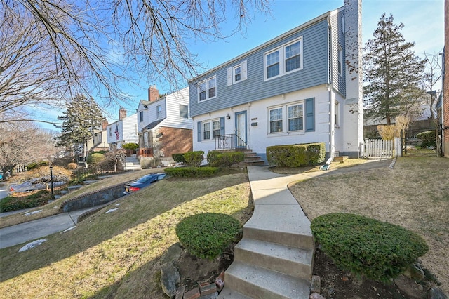 view of front of home with a front lawn