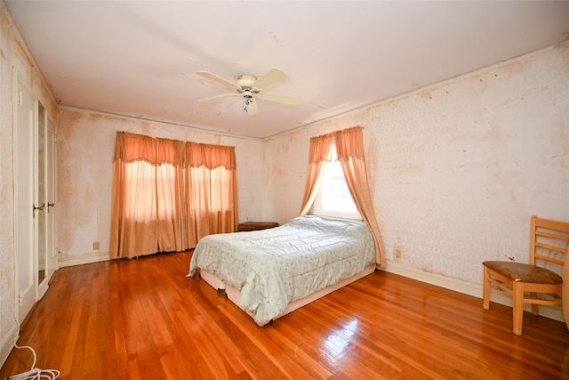 bedroom featuring ceiling fan and hardwood / wood-style floors