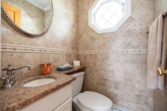 bathroom with vanity, tile walls, and toilet