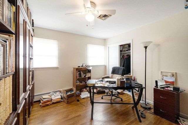 home office featuring hardwood / wood-style flooring and ceiling fan