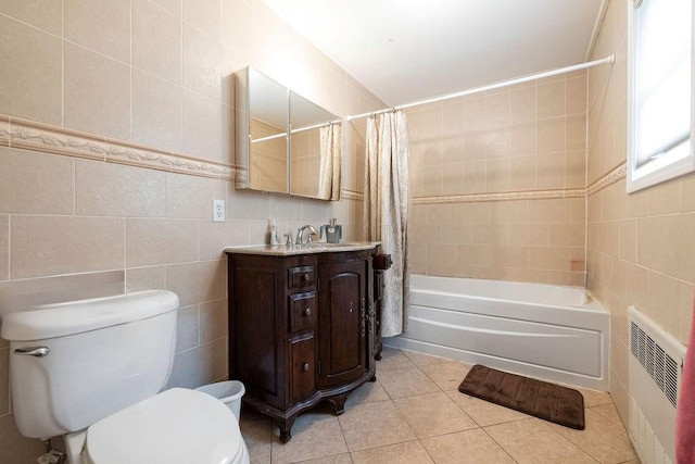 full bathroom with tile patterned flooring, vanity, tile walls, and shower / tub combo