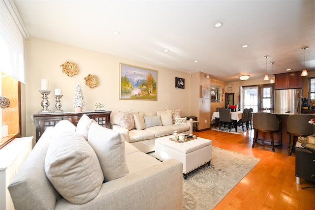 living room with light hardwood / wood-style flooring