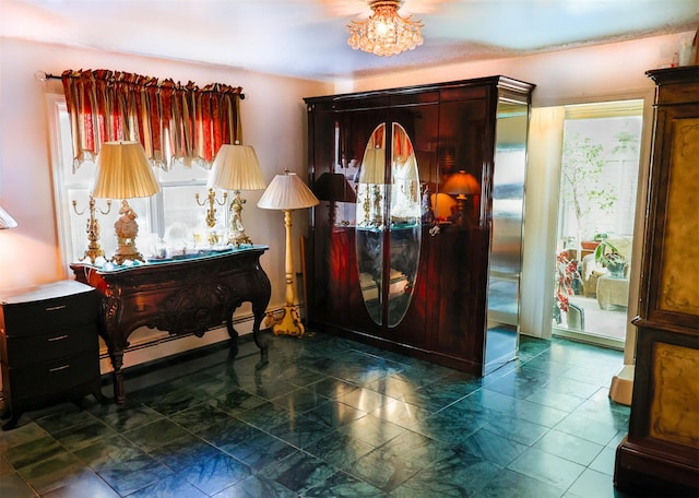 entrance foyer with a baseboard heating unit